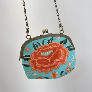 Bolso turquesa bordado naranja