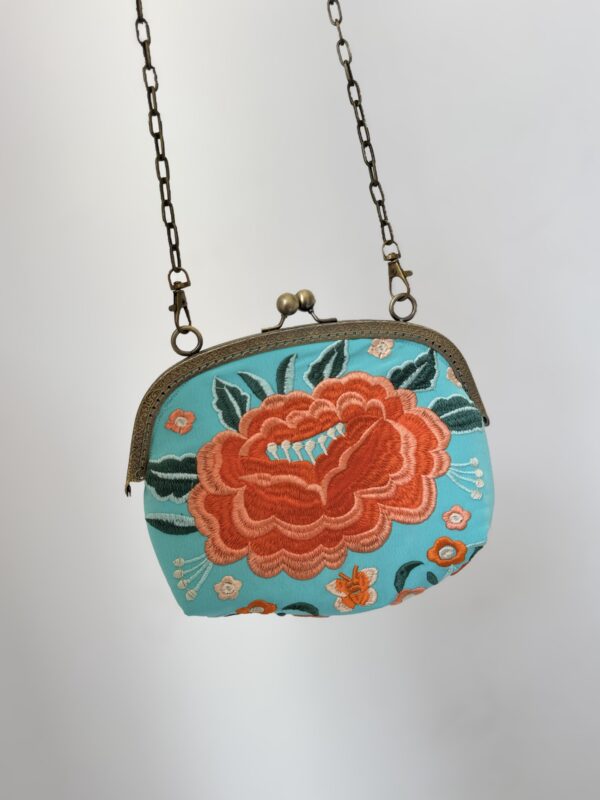 Bolso turquesa bordado naranja